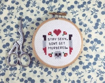 My Favorite Murder "Stay Sexy Don't Get Murdered" Completed Cross Stitch in Hoop