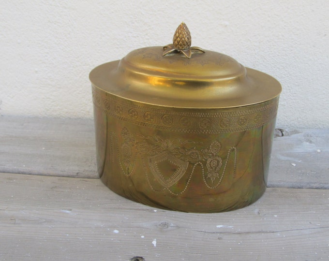 Decorative Brass box, vintage oval brass storage box, engraved with shield, flowers and garlands, with acorn handle on the lid, cookie jar