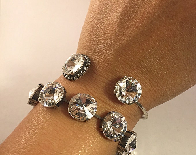 Glamorous and classic bangle cuff Swarovski crystal bracelet. Perfect accessory to go from the office and then out for the evening.