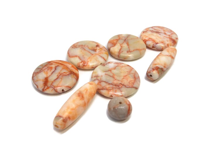 Redline marble beads, five 26-30mm flat round, two 31x10mm-32x10mm oval and one 12mm round bead, a ready made project!