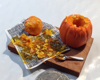Miniature pumpkin carving scene