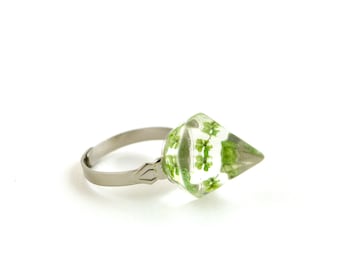Transparent with green mini pressed flowers faceted pyramid resin ring.