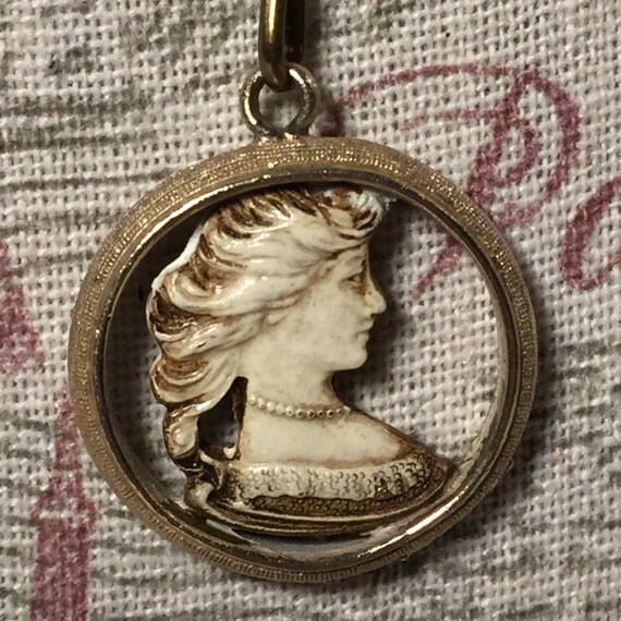 Items similar to Cameo Necklace, Enamel Cutout Cameo in Goldtone Circle