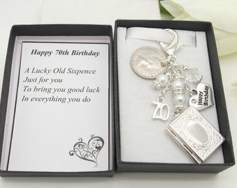 Personalised happy 70th birthday gift. Clear book locket. Random sixpence, charm, keyring, gift box, choice of heart and number charm
