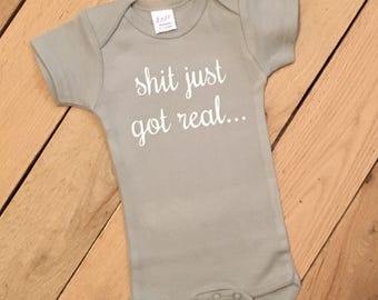 shit just got real, pregnancy reveal, pregnancy announcement onesie, funny pregnancy reveal