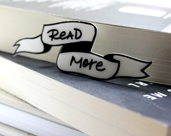 Shrink plastic "READ MORE" brooch