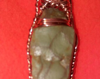 Spider web Jasper pendant on red. Rope copper wire wrapped