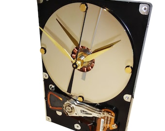 Hard Drive Clock with Its Contoller Circuit Board as the Stand and Mirrored Disk Platter as the Dial.