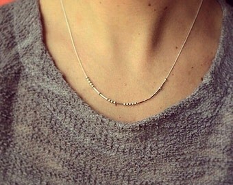 Custom silver Morse code necklace with smooth dash beads. You choose your message!
