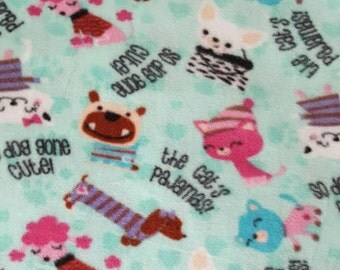 Cats and Dogs fleece dog pajama. Available in S, M or L.Sizes under item details box. Machine Washable and open. underneath for potty breaks