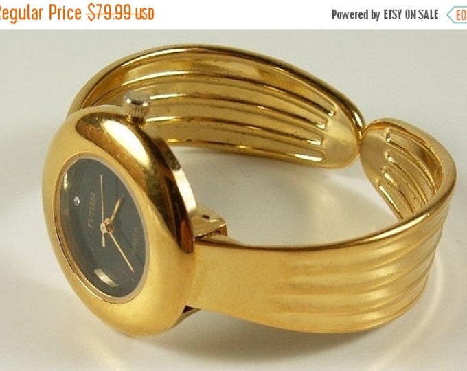 Storewide 25% Off SALE Lovely Vintage Futura gold tone quartz timepiece with ribbon designed textured clip style bracelet band