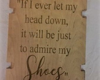 If I ever let my head down, it will be just to admire shoes" Plaque