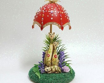 Decorated Goose Egg. Cats Under an Umbrella.