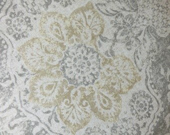 Round floor pouf ottoman pillow cushion cover in cream and taupe has casual subtle monochromatic traditional floral motif