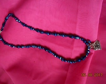 You Have The Lock And Key With This Metallic Blue Necklace!