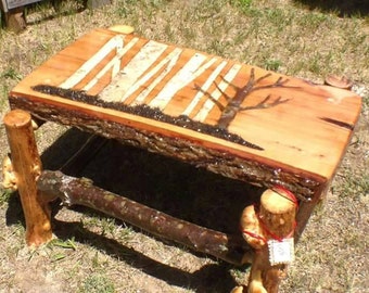 Hand carved, birch in lay, rustic coffee table.