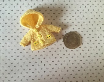 Dolls house Miniature 1/12th knitted baby doll lemon rain jacket