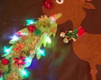 Ugly Christmas sweater barfing reindeer on front and pooping reindeer on back lights up ..hilarious original design.
