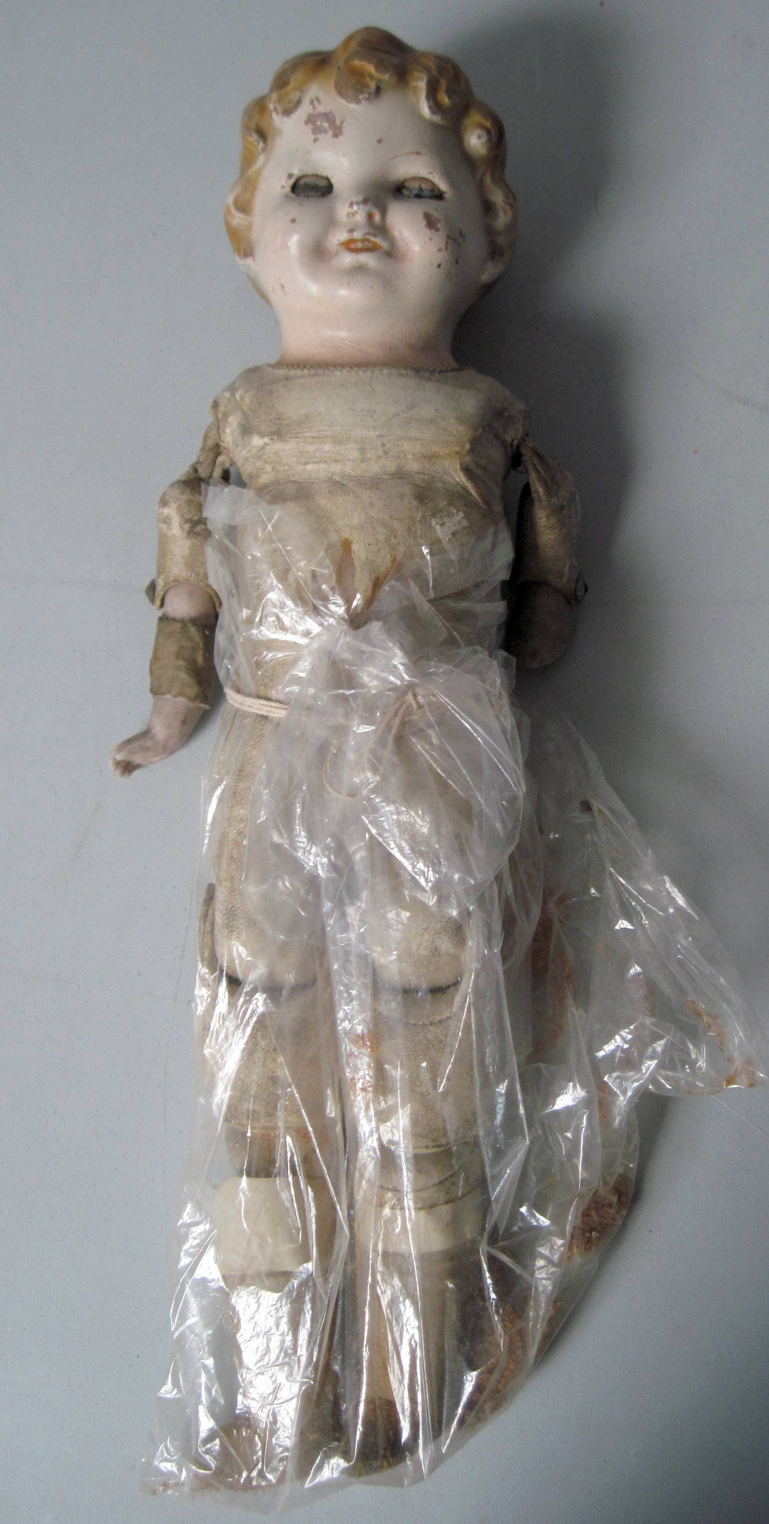 Antique doll with jointed leather sawdust body