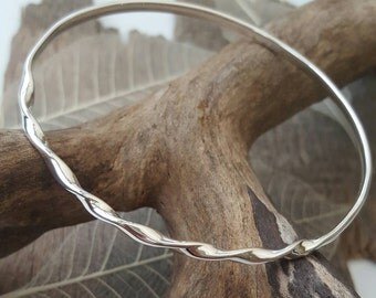 Sterling silver bangle with a tight twist