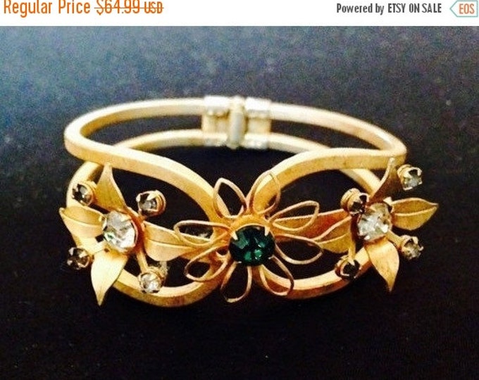 Storewide 25% Off SALE Vintage Clamper Cuff Style Gold Tone Designer Bracelet Featuring Rainbow Assorted Colored Stones With Floral Design