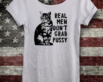 Anti Trump Shirt. Impeach Trump Shirt. Real Men Don't Grab Pussy! Dump Trump Feminist Tee. Off-the-Shoulder Ash White. Nasty woman!