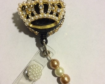 Goldtone crown with pearls and rhinestones retractable badge holder