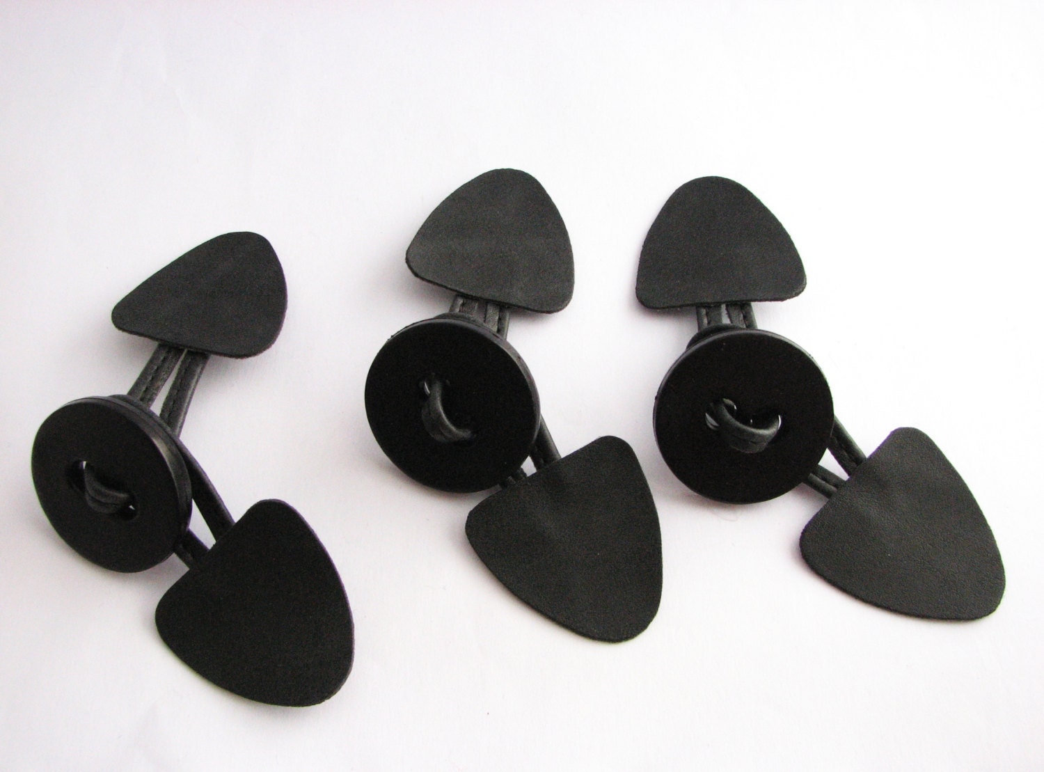 3 black toggle closures for a duffle coat sew on button