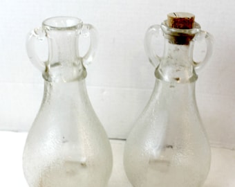 vintage glass bottles handled with cork textured