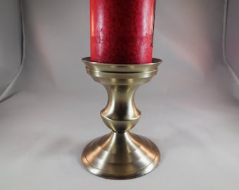 Vintage metal candle holder for pilar candles.
