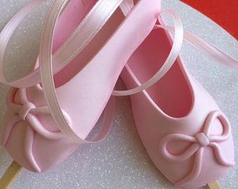 Custom Edible pink ballet slippers ballerina shoes with sticks gum paste fondant cake topper.