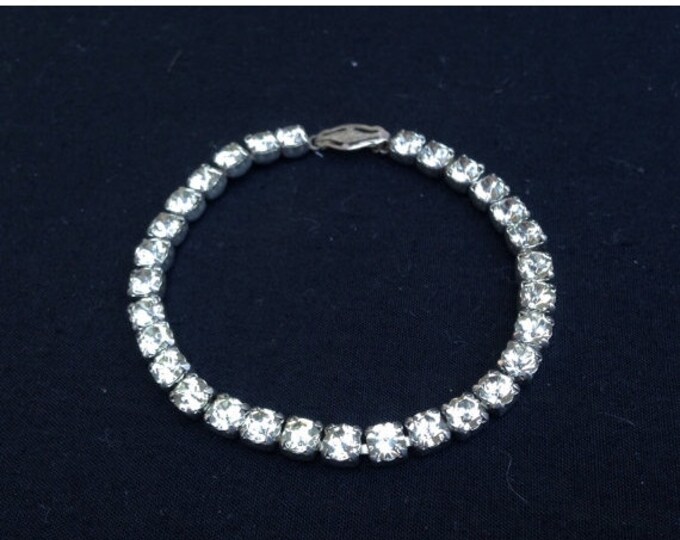 Storewide 25% Off SALE Vintage Sterling Silver Faceted Designer Tennis Bracelet Featuring Channel Set Single Row Design