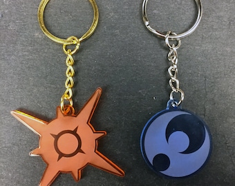 Pokémon Sun & Moon Symbol Keychain (transparent acrylic, laser-cut)