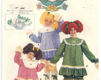 Butterick 6919 Size M, 6, 8. Girl's size sewing pattern for Cabbage Patch Kids costume, complete with iron-on decals, dress, bloomers, wig
