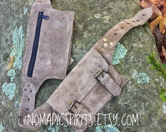 Unisex - 4 pocket festival utility belt with buckles and snap lock closures.