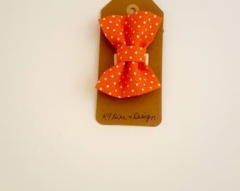 Orange polka dot dog bow tie.