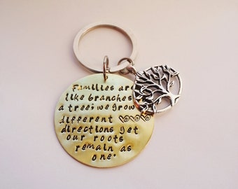 Families are like branches on a tree; we grow in different directions yet our roots remain as one.Hand stamped Keychain.Personalized gift.