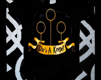 She's A Keeper Onesie; Harry Potter Onesie; Quidditch Onesie; She's A Keeper Crawler; Quidditch She's A Keeper Bodysuit; Quidditch Crawler