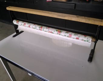 This vintage general store wrapping paper roll holder.