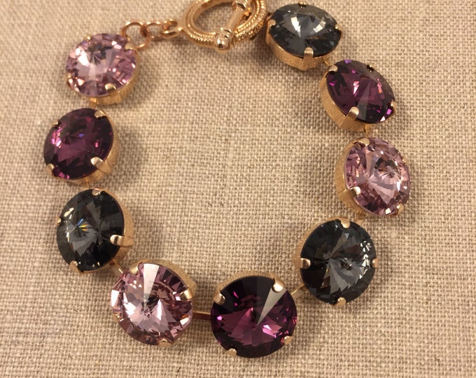 Glamorous fashion forward bold purple amethyst multi colored 14mm rivoli Swarovski crystal tennis bracelet jewelry in rose gold.