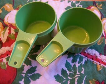 two fun tupperware measuring cups
