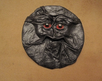 Grichels leather sew-on patch - black with red carousel horse eyes