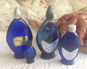 Four antique bottles of Evening in Paris perfume