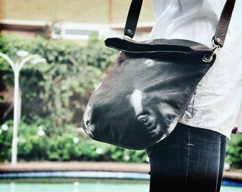 Leather handbag, messenger type, hand sewn, soft leather for appearance and touch. Lightweight handbag, 100% leather.