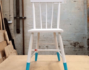 White vintage chair with paint-dipped feet