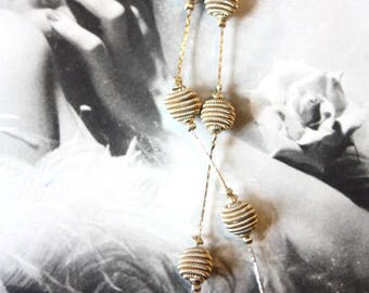 A 1960s, long necklace, made by Monet.