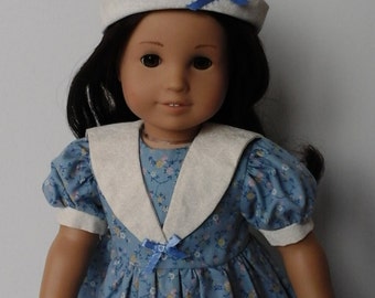 Blue floral dress with sailor style collar and sailor hat. Will fit 18 inch doll such as American Girl, My Life As and My Generation dolls.