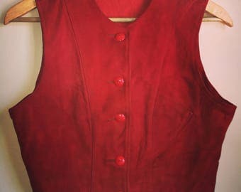 1930s nubuck leather buckle back vest with celluloid buttons and slant pocket.