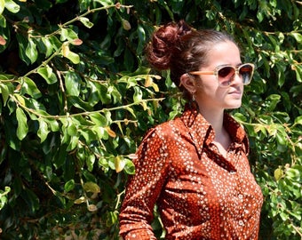 Vintage brown floral disco style shirt size small.