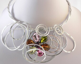 Unique silver wire necklace.Bib style,modern and abstract.Pink,green and bronze.